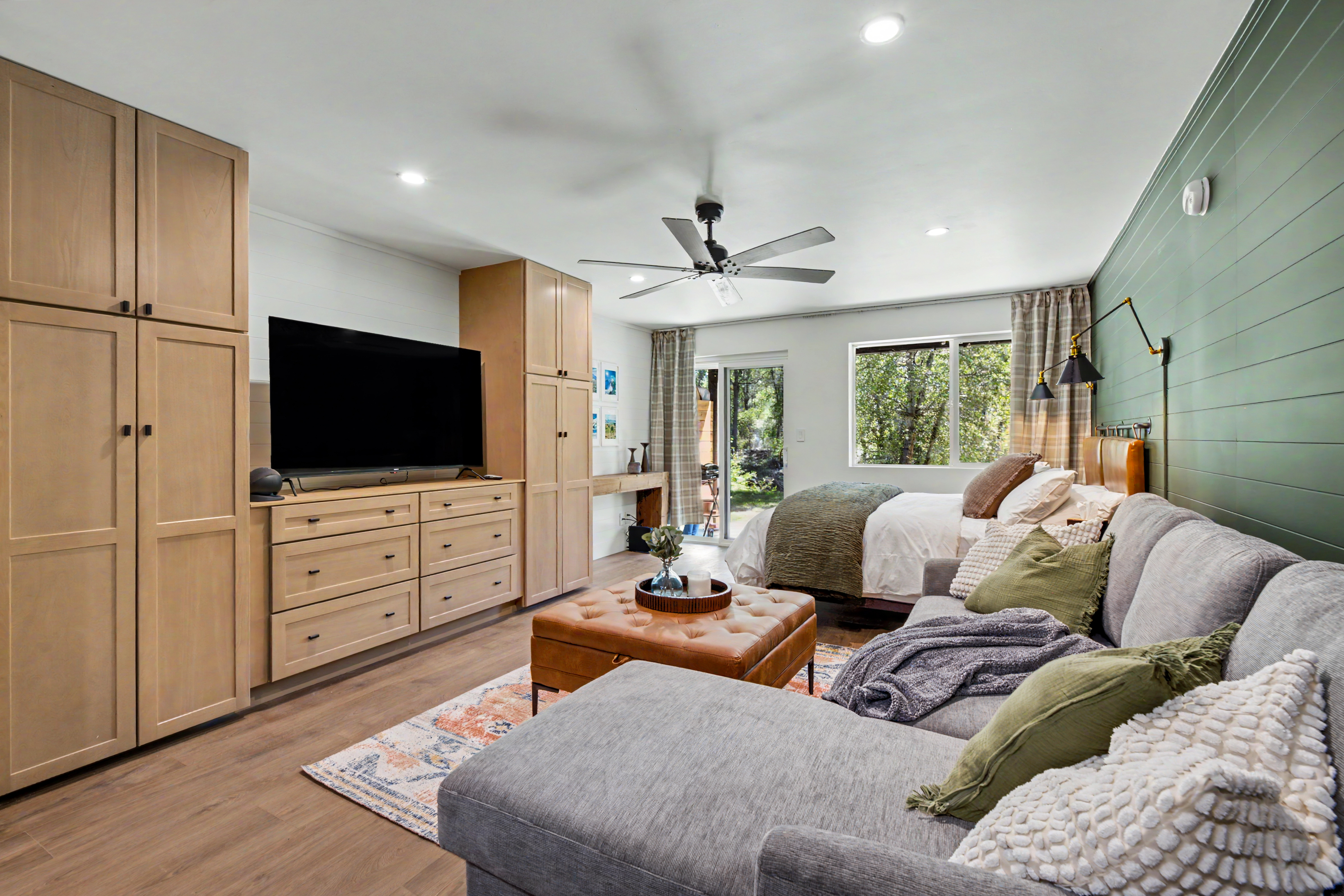 Open studio interior with sectional and kitchen