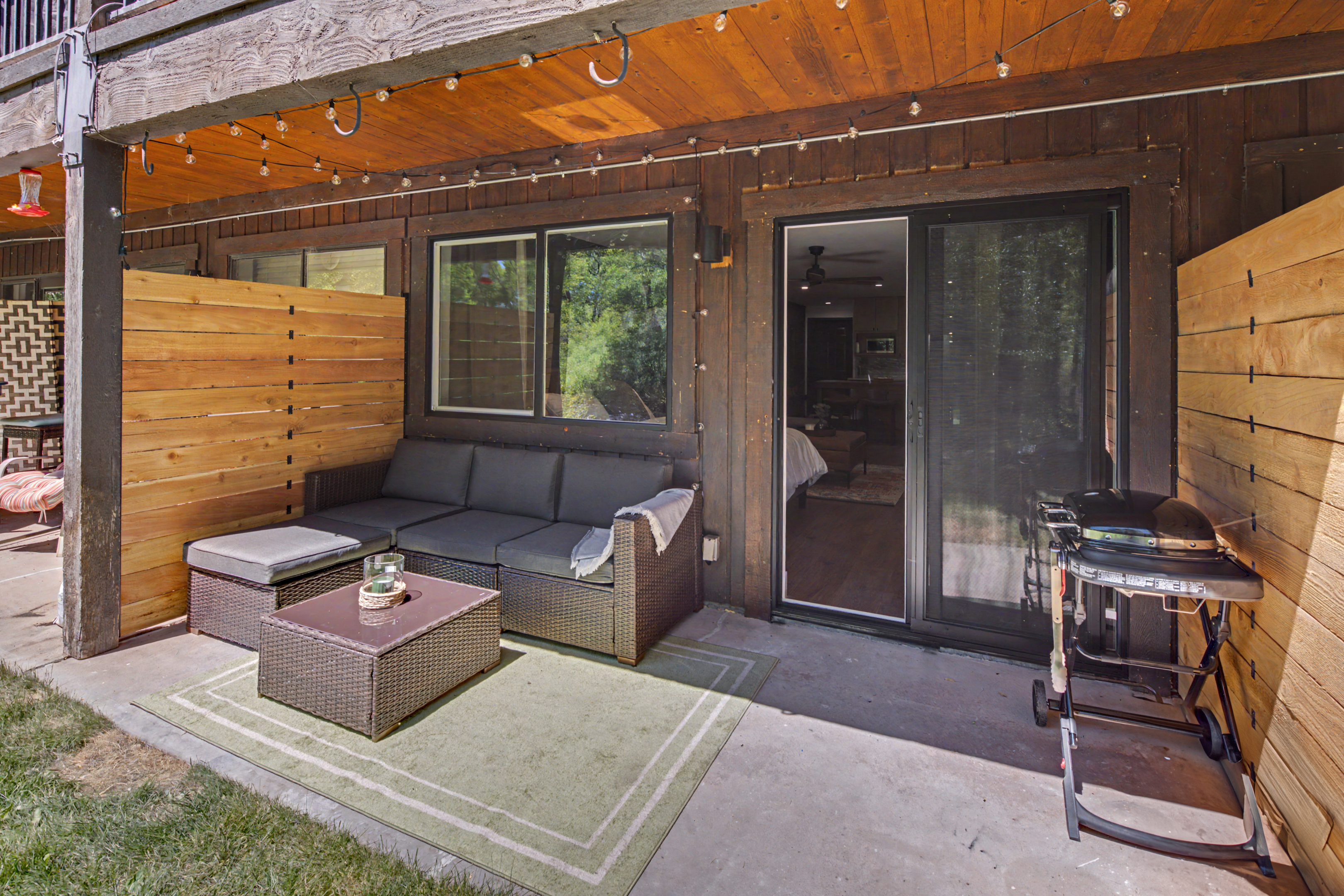 Patio with outdoor seating and grill