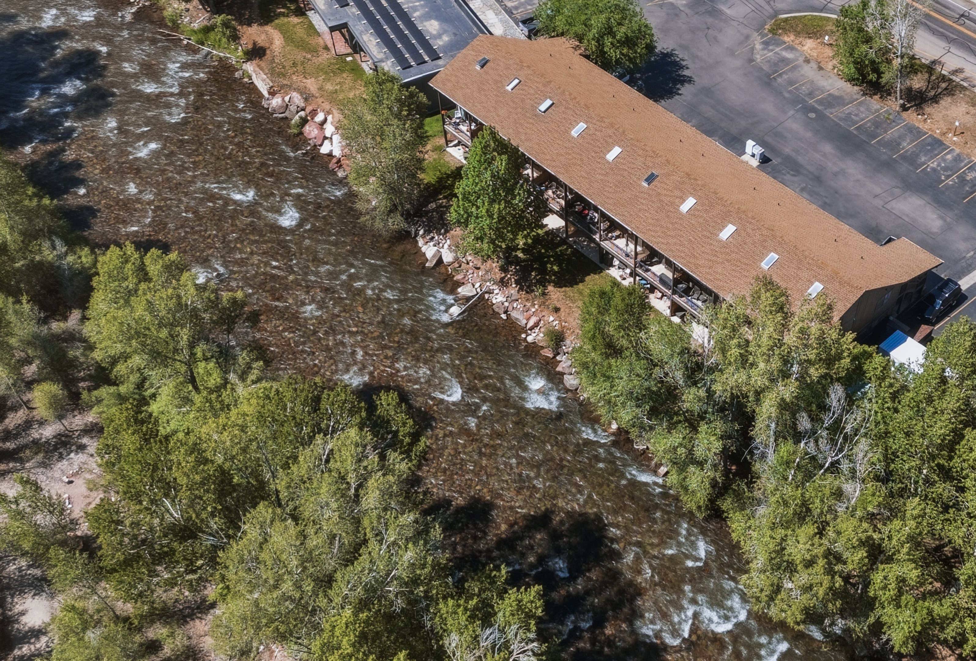 Aerial close-up of the property along the river