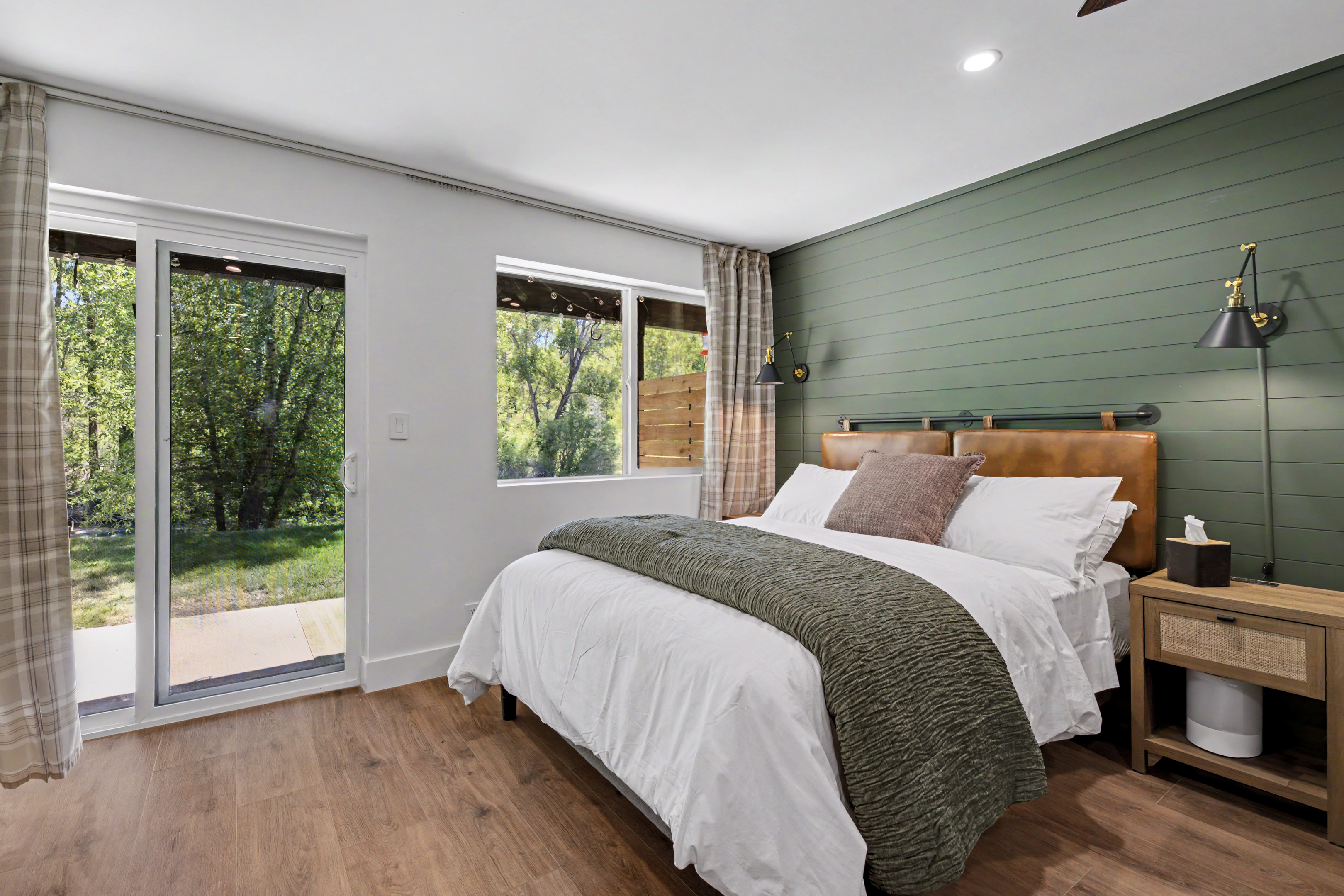 Bedroom with green accent wall